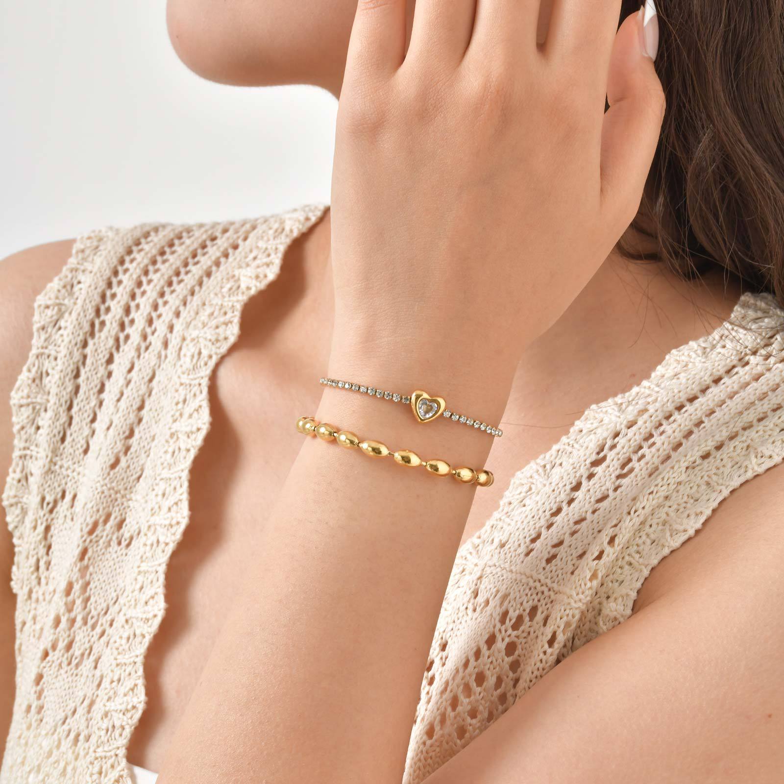 Stahlrohrarmband mit Herz-Motiv und Steinen in Peach-Farbe